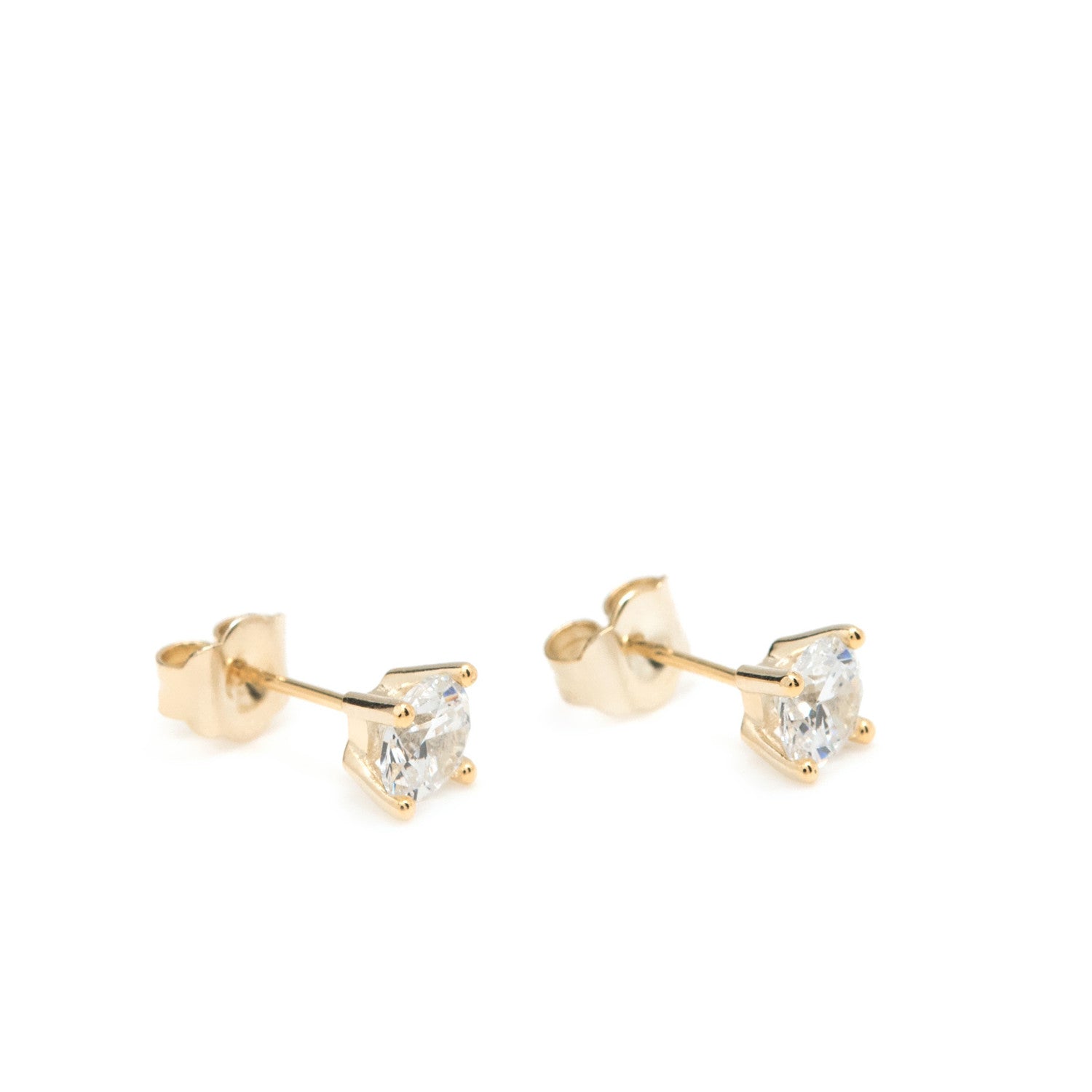 Pendientes pequeños diseño botón con circonita dorados