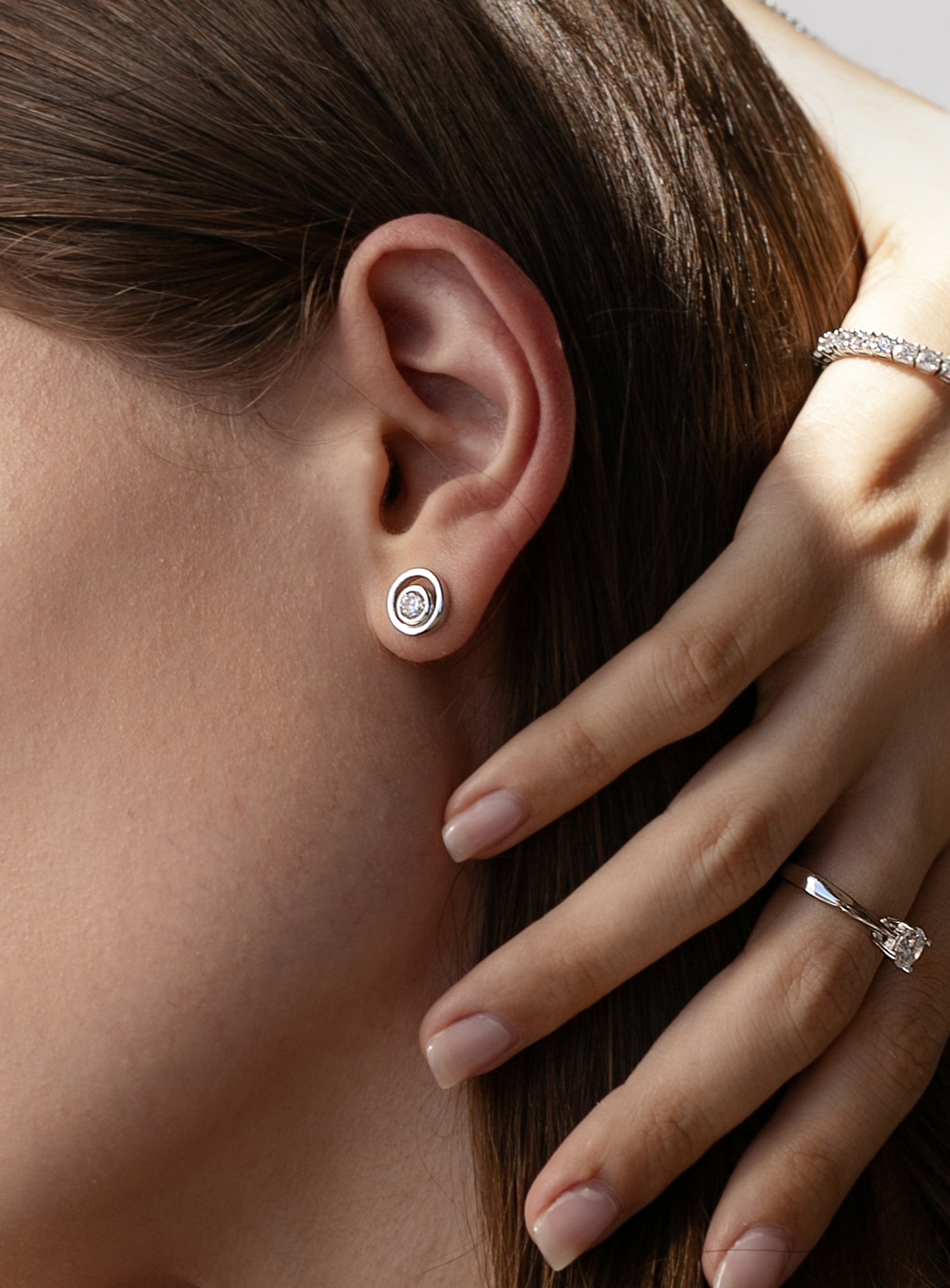 Double circle design stud earrings with central cubic zirconia