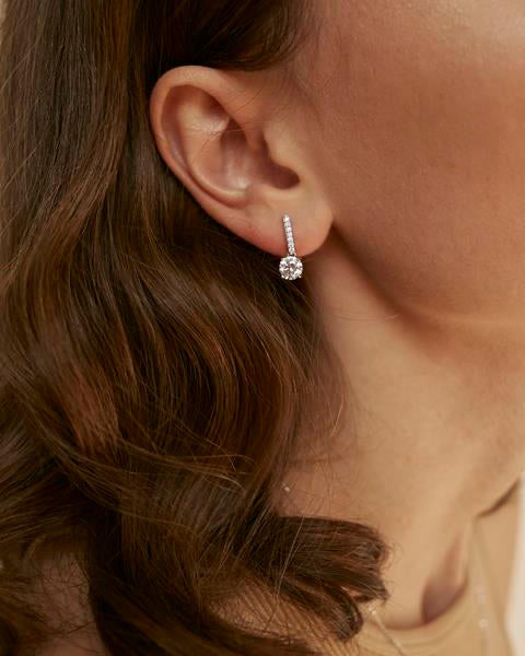 Small, sparkly stick-shaped earrings with cubic zirconia