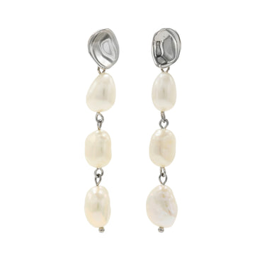 Long pearl earrings with an irregular liquid design.