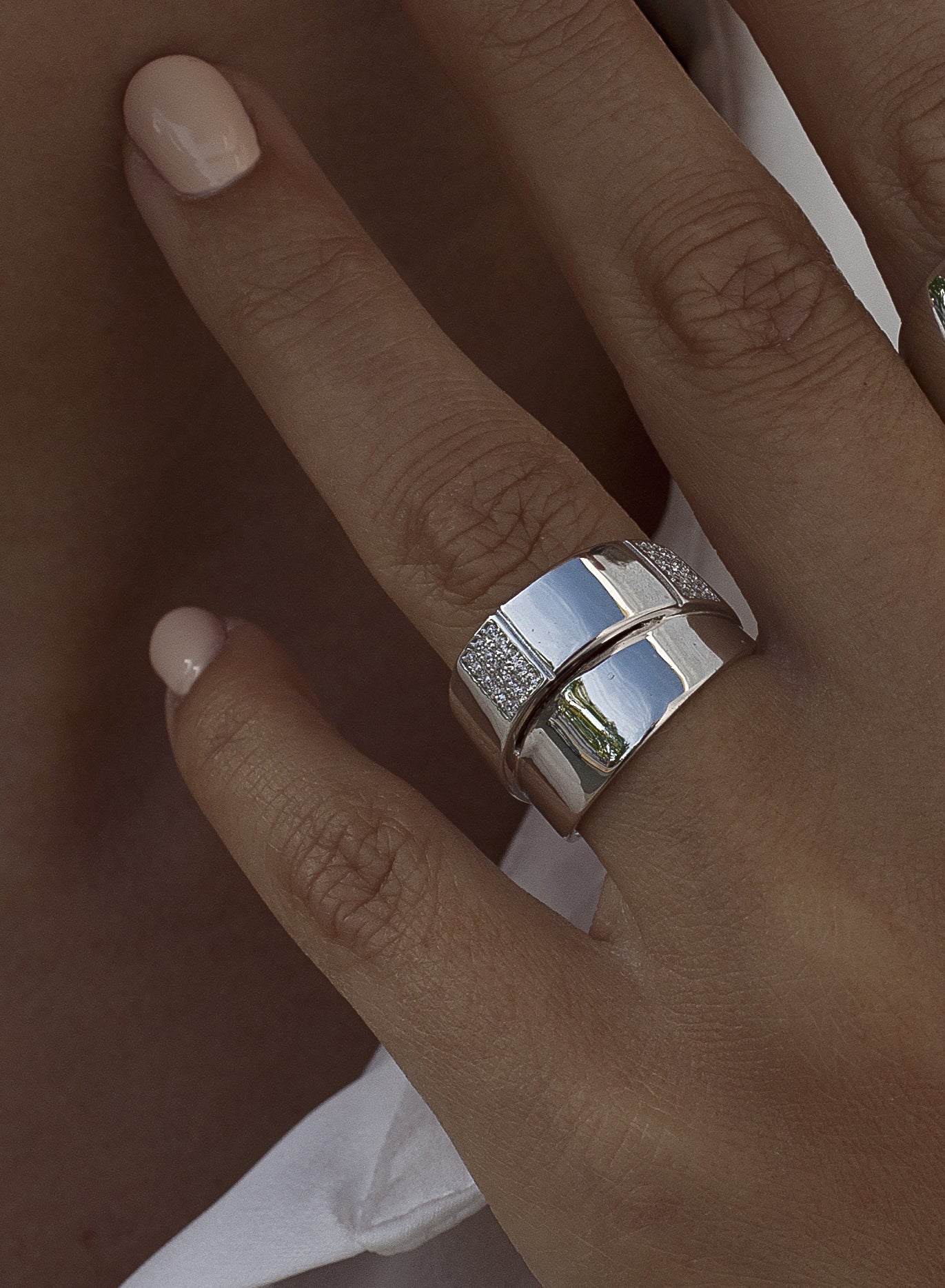 Wide rings with a double-level design and cubic zirconia details