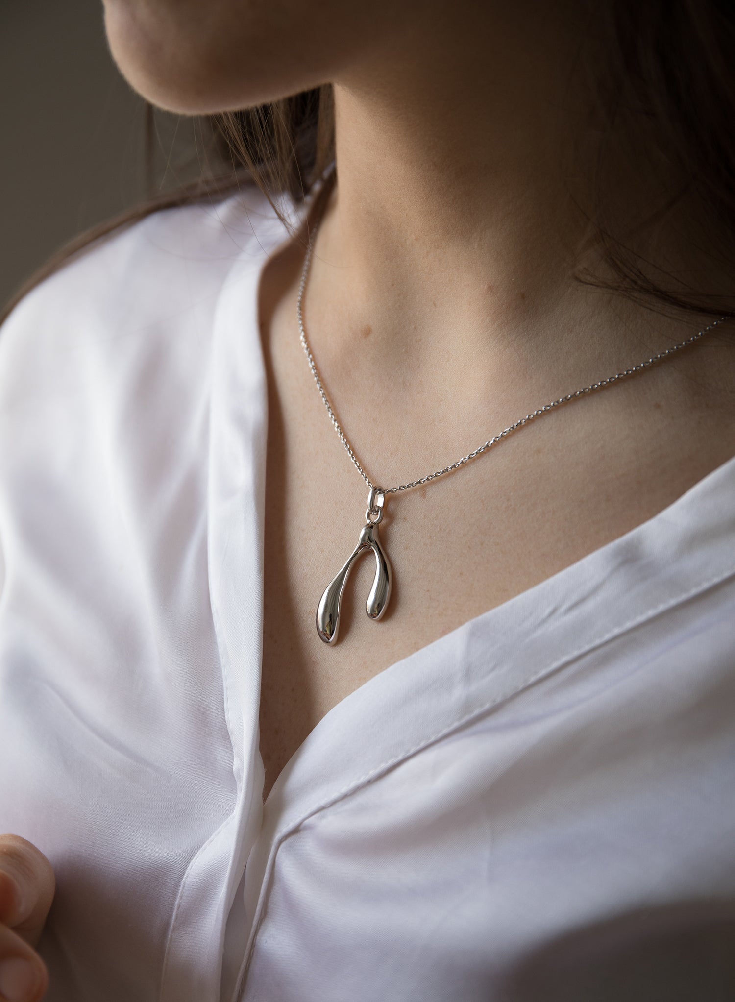 Original silver necklaces for women with a double teardrop design