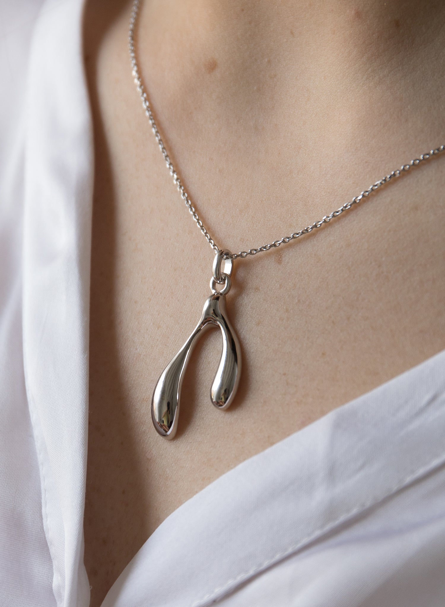 Original silver necklaces for women with a double teardrop design