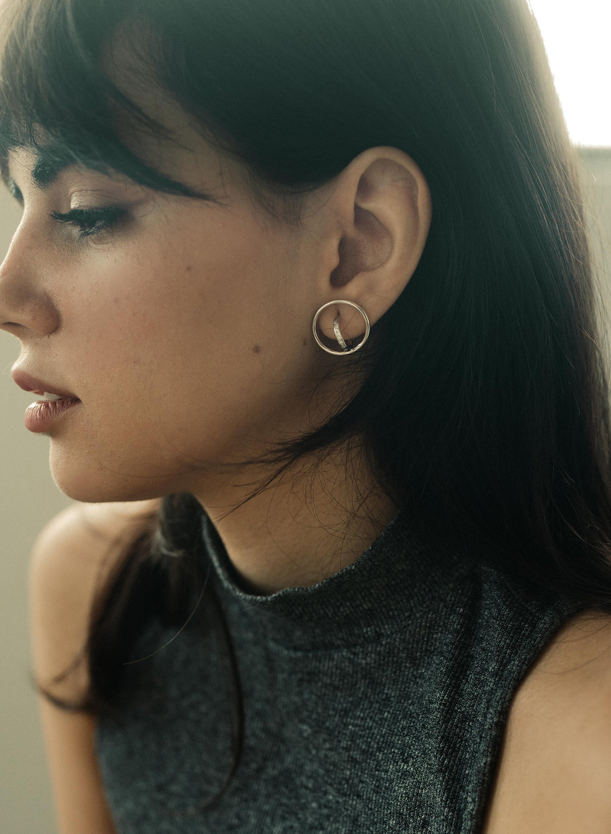 Original hoop earrings with a double crossed hoop design and cubic zirconia