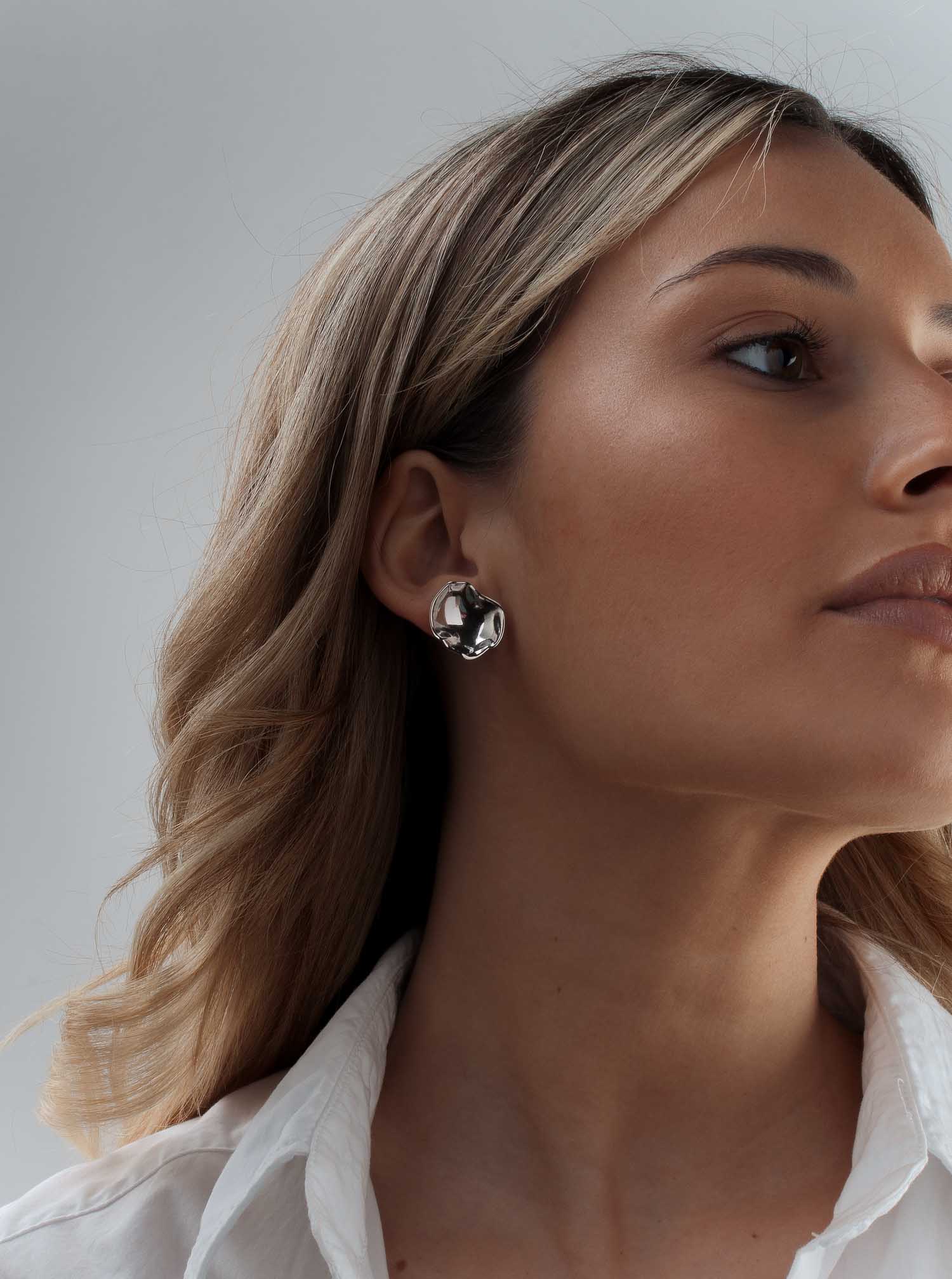 Original silver earrings with a convex design