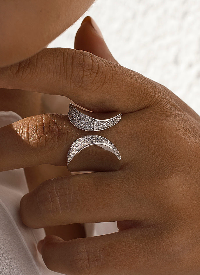 Open design rings formed by side cubic zirconia