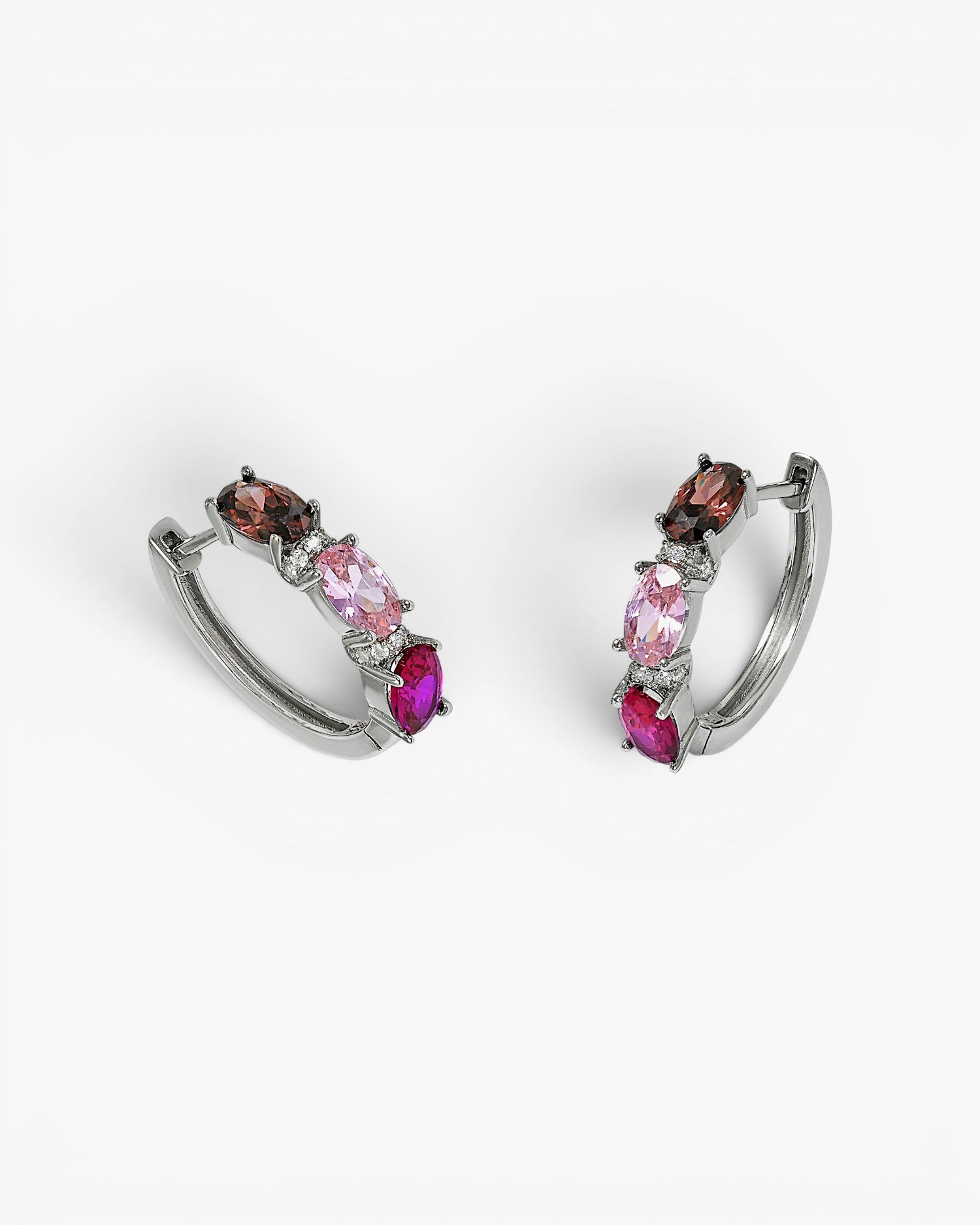 Small silver hoop earrings with a pink design