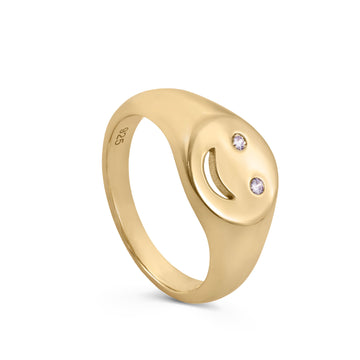 Anillo sello diseño smile con circonitas y baño de oro