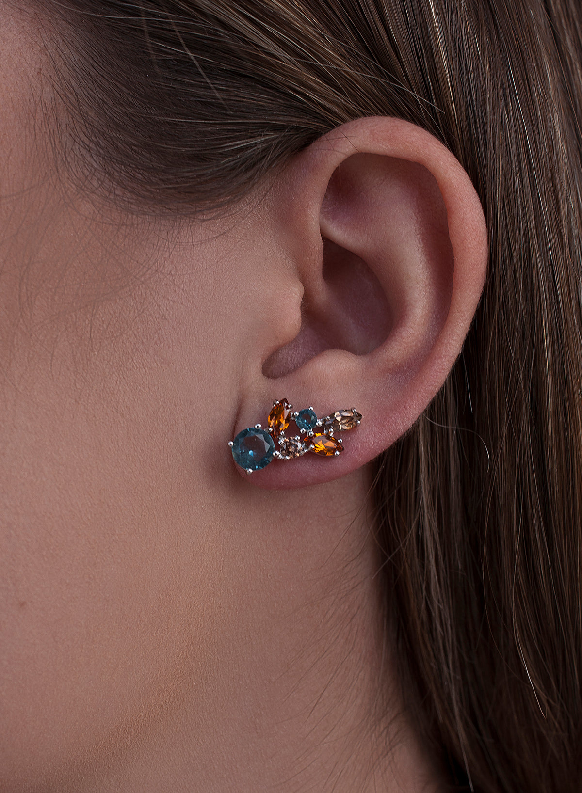 Silver climber earrings with blue leaf design