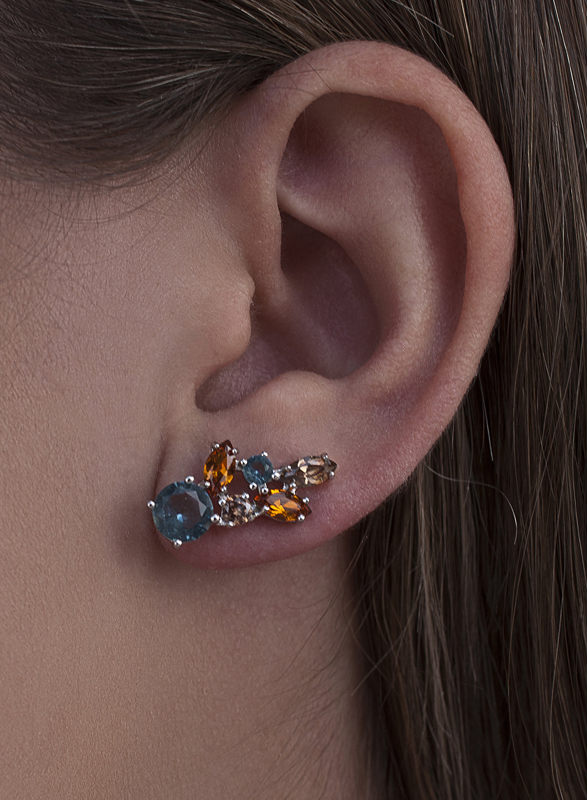 Silver climber earrings with blue leaf design