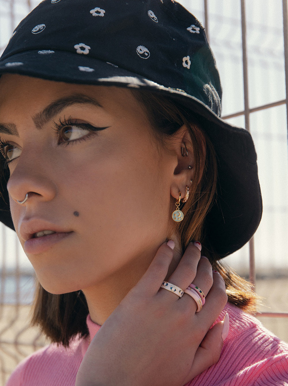 Hoop earrings with moon and star medallion design pendants