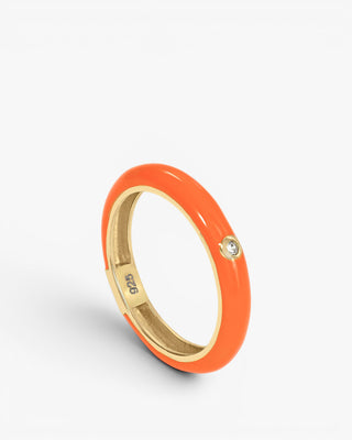 Orange enamel ring with a central cubic zirconia design, gold plated