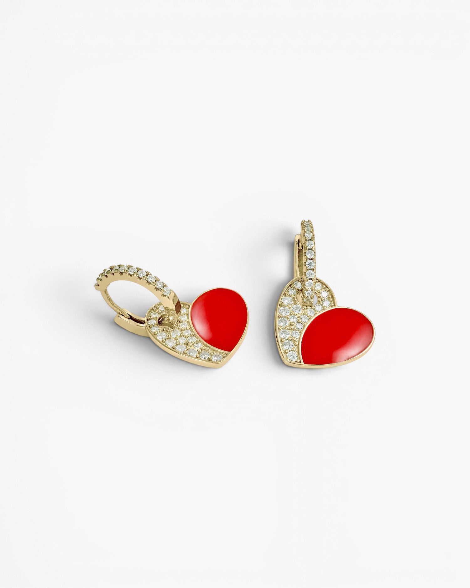 Earrings with red enamel heart design pendants
