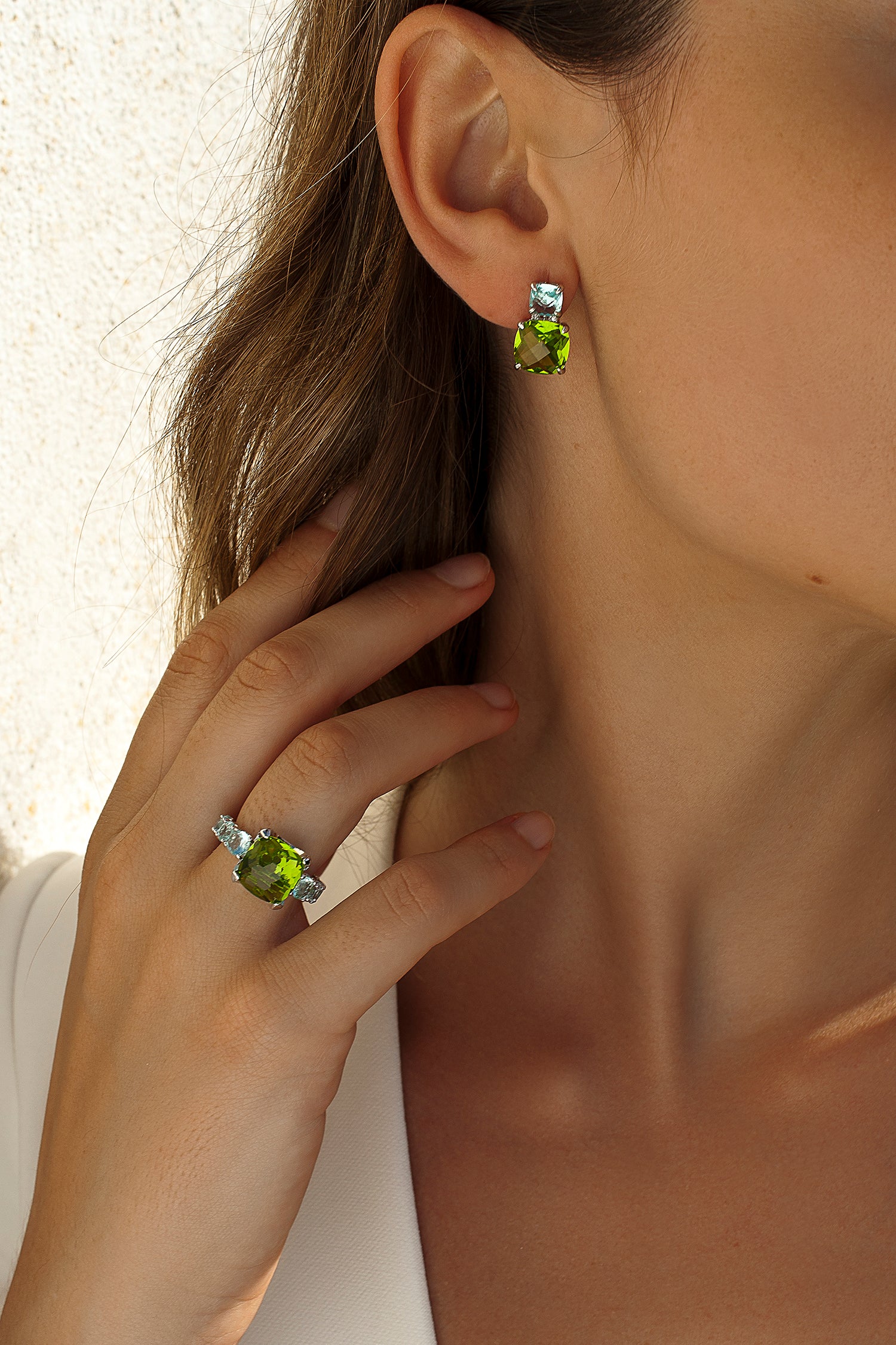 Colorful gemstone earrings with a two-tone gem design