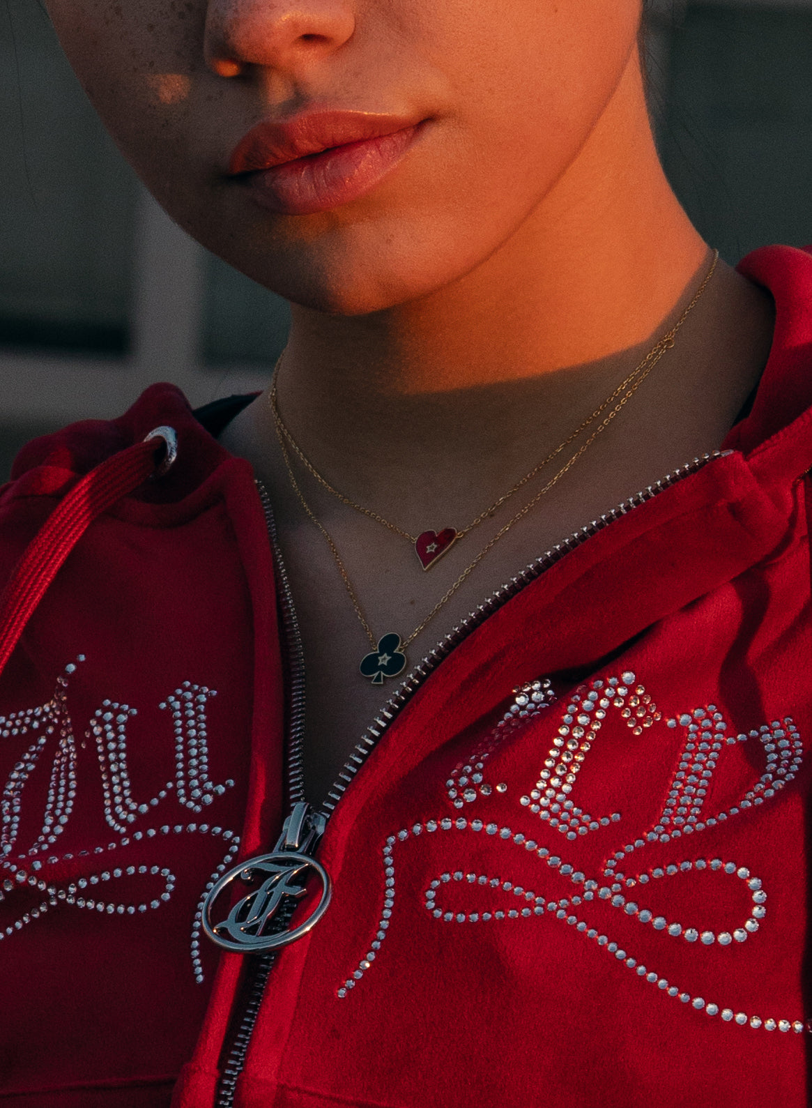 Small heart-shaped pendants with red enamel