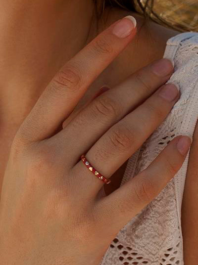 Delicate rings with a heart design and red enamel