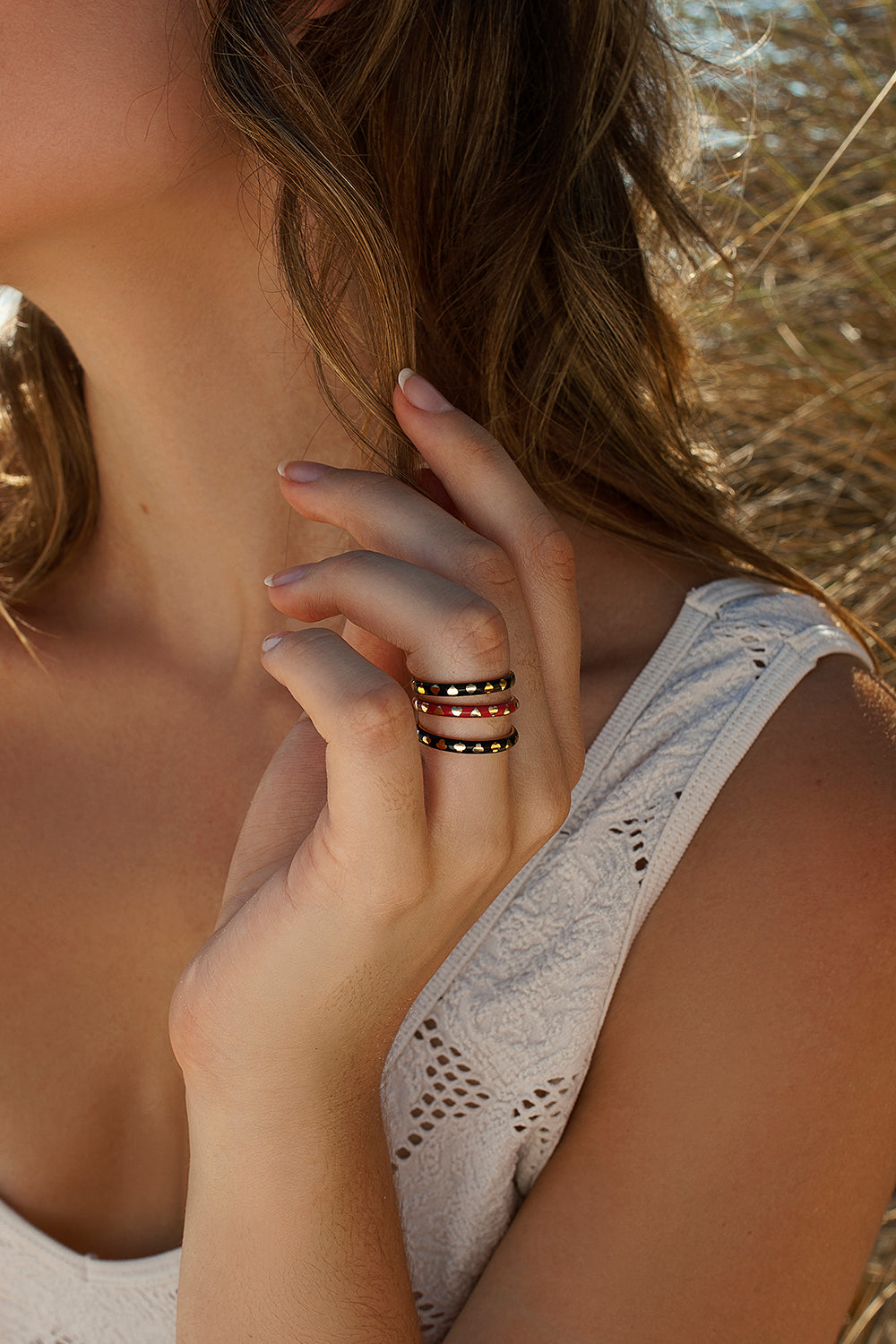 Delicate rings with a heart design and red enamel