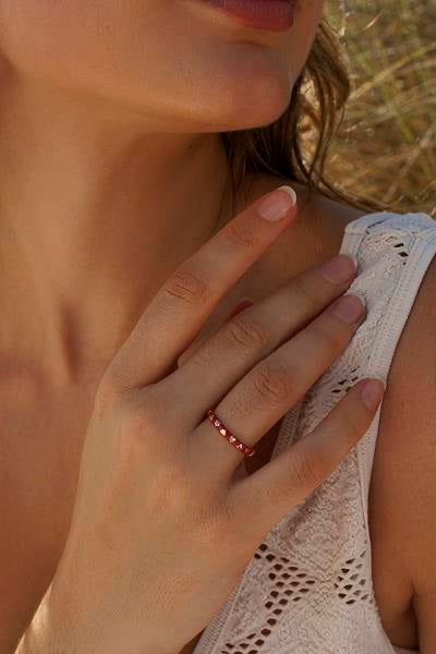 Delicate rings with a heart design and red enamel