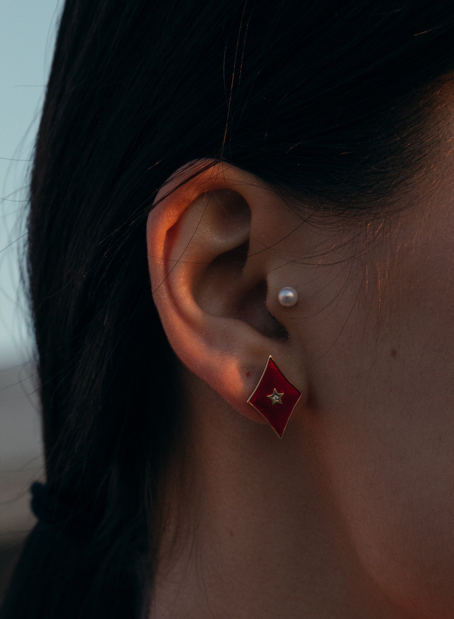 Small diamond-shaped earrings with red enamel