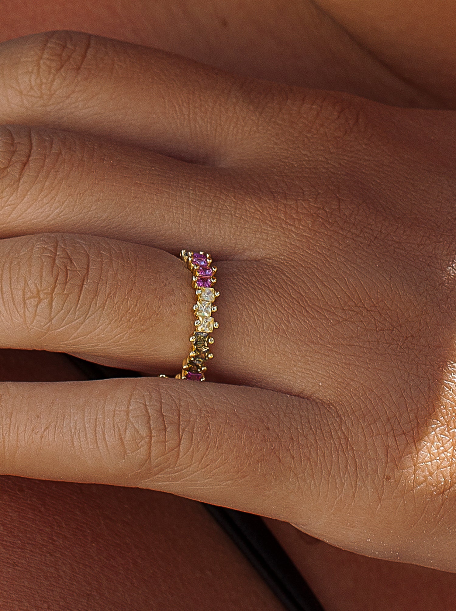 Silver ring with colored stones in princess cut with prongs