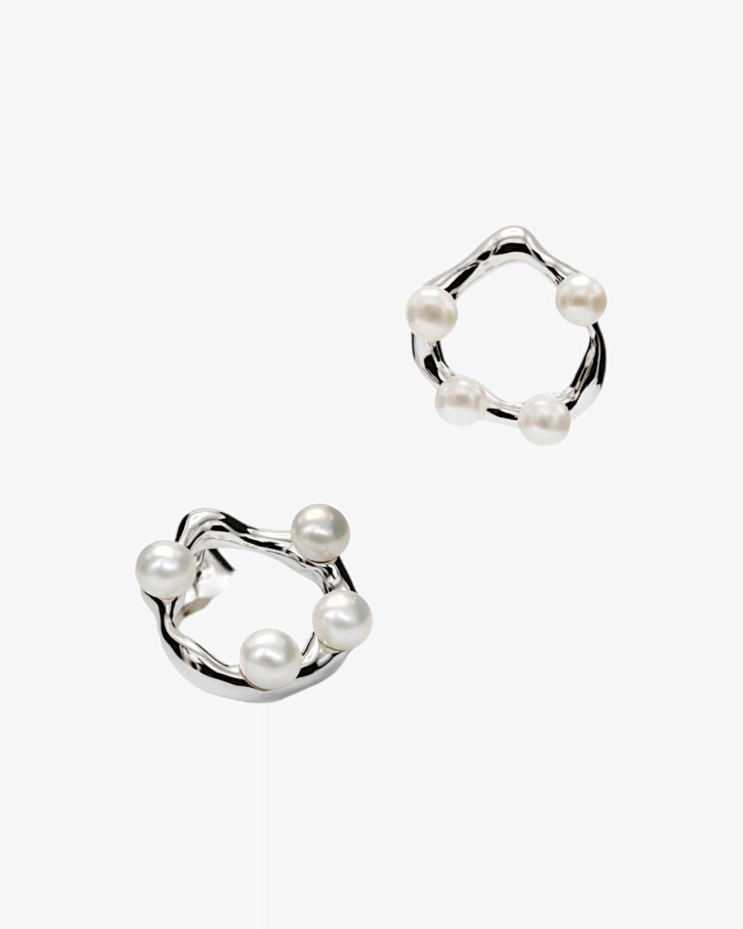 Original silver earrings with an irregular circular design and embedded mini pearls