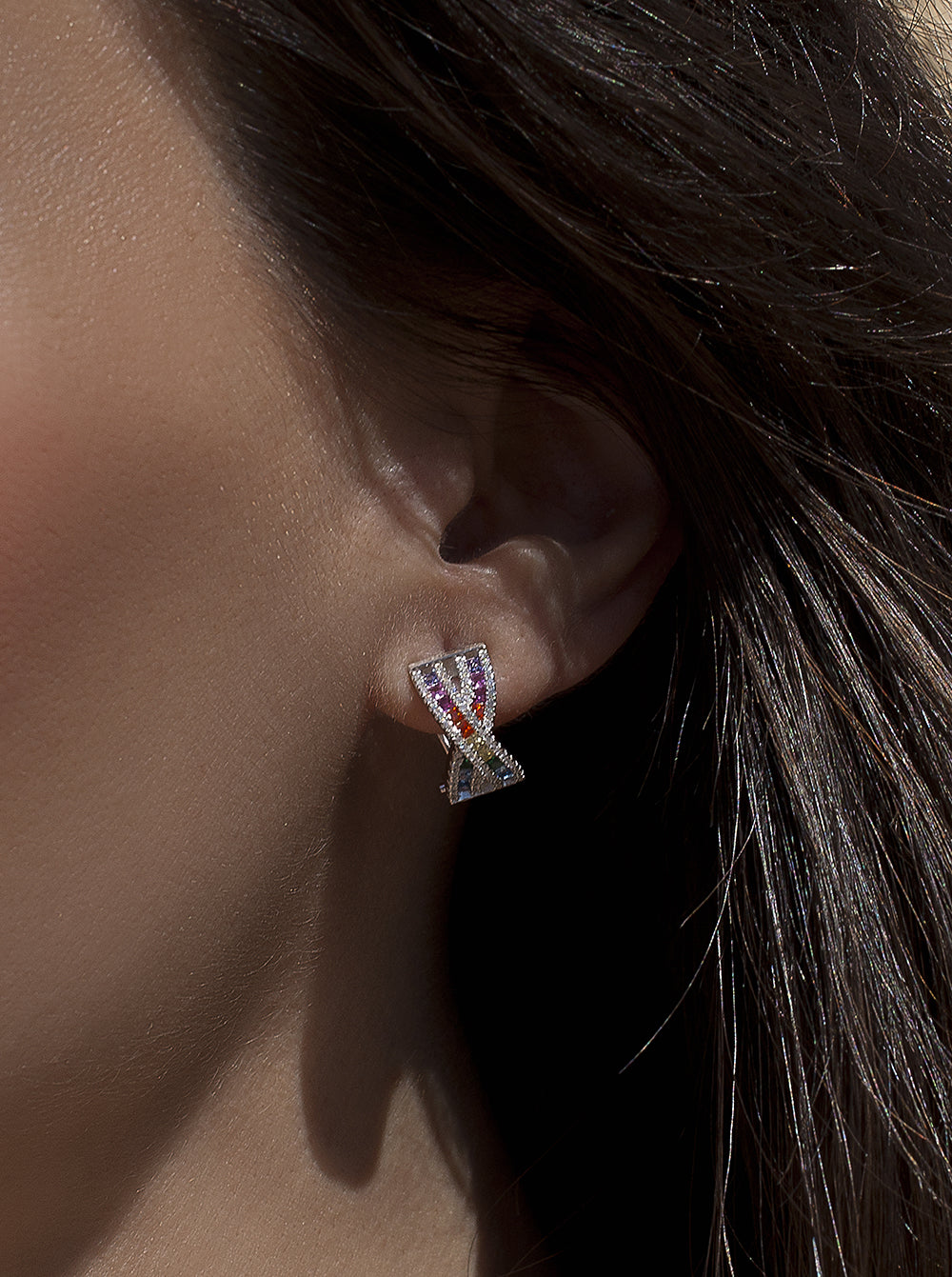 Omega clasp earrings with multicolored crossed rail design