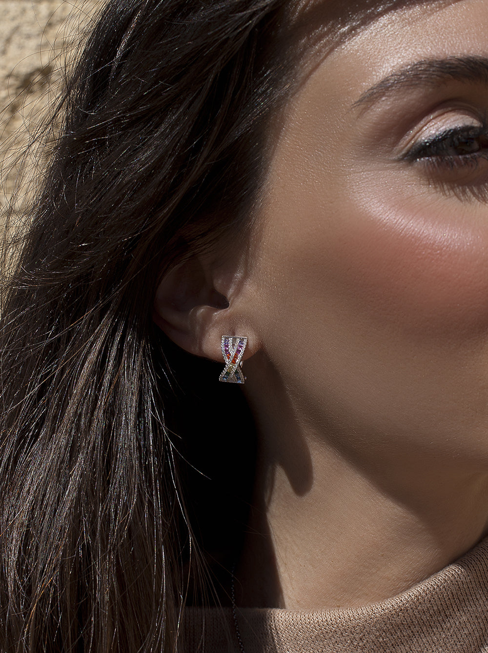 Omega clasp earrings with multicolored crossed rail design