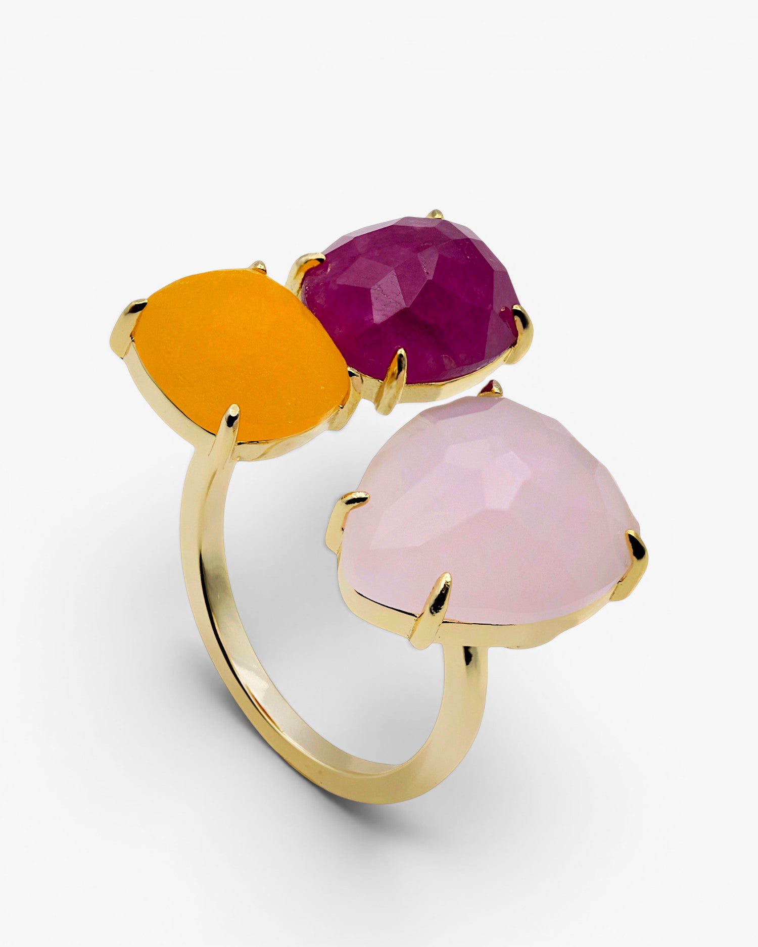 Silver rings with open design stones in pink tones