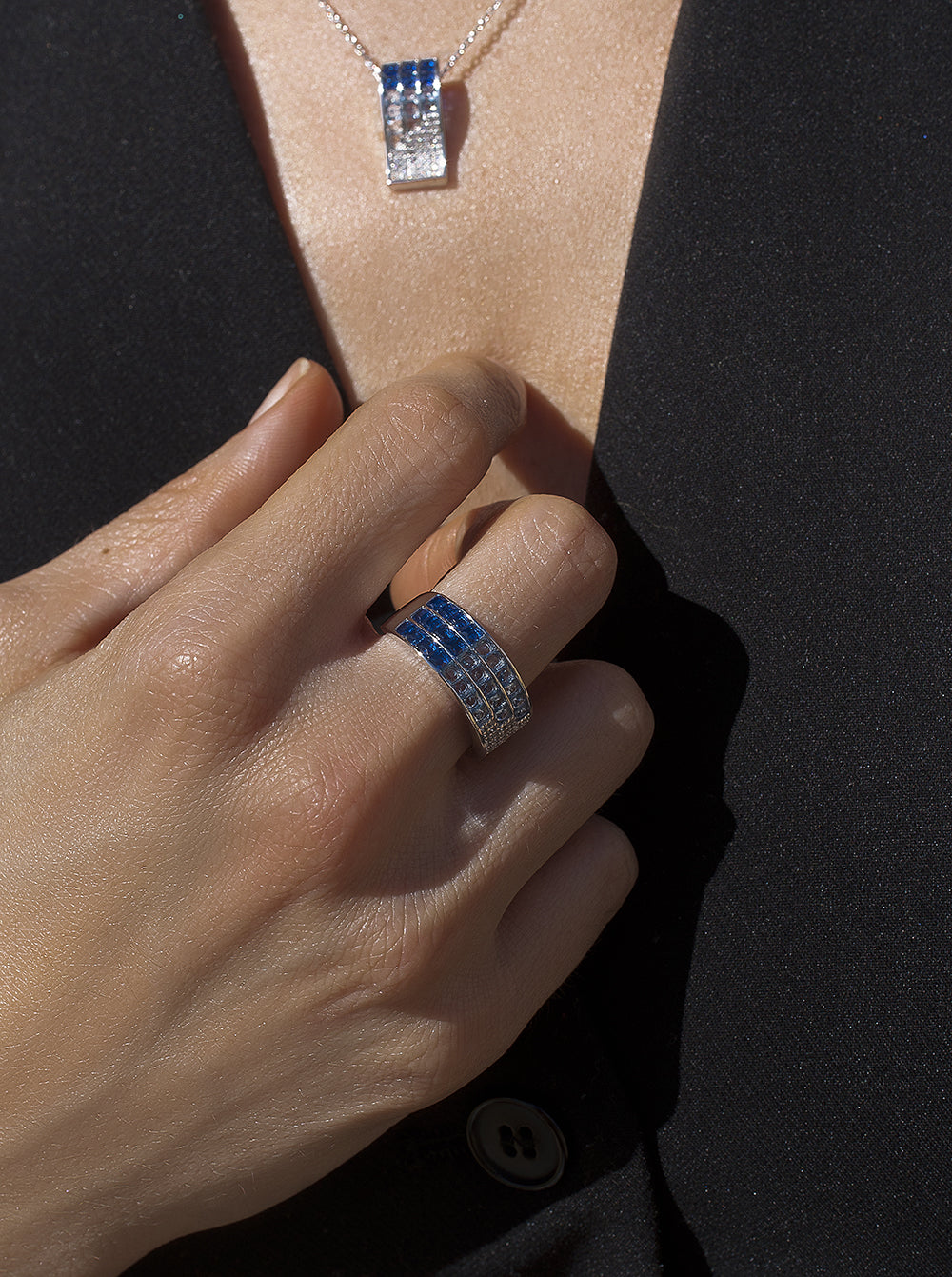 Rings with triple rail stones in shades of blue