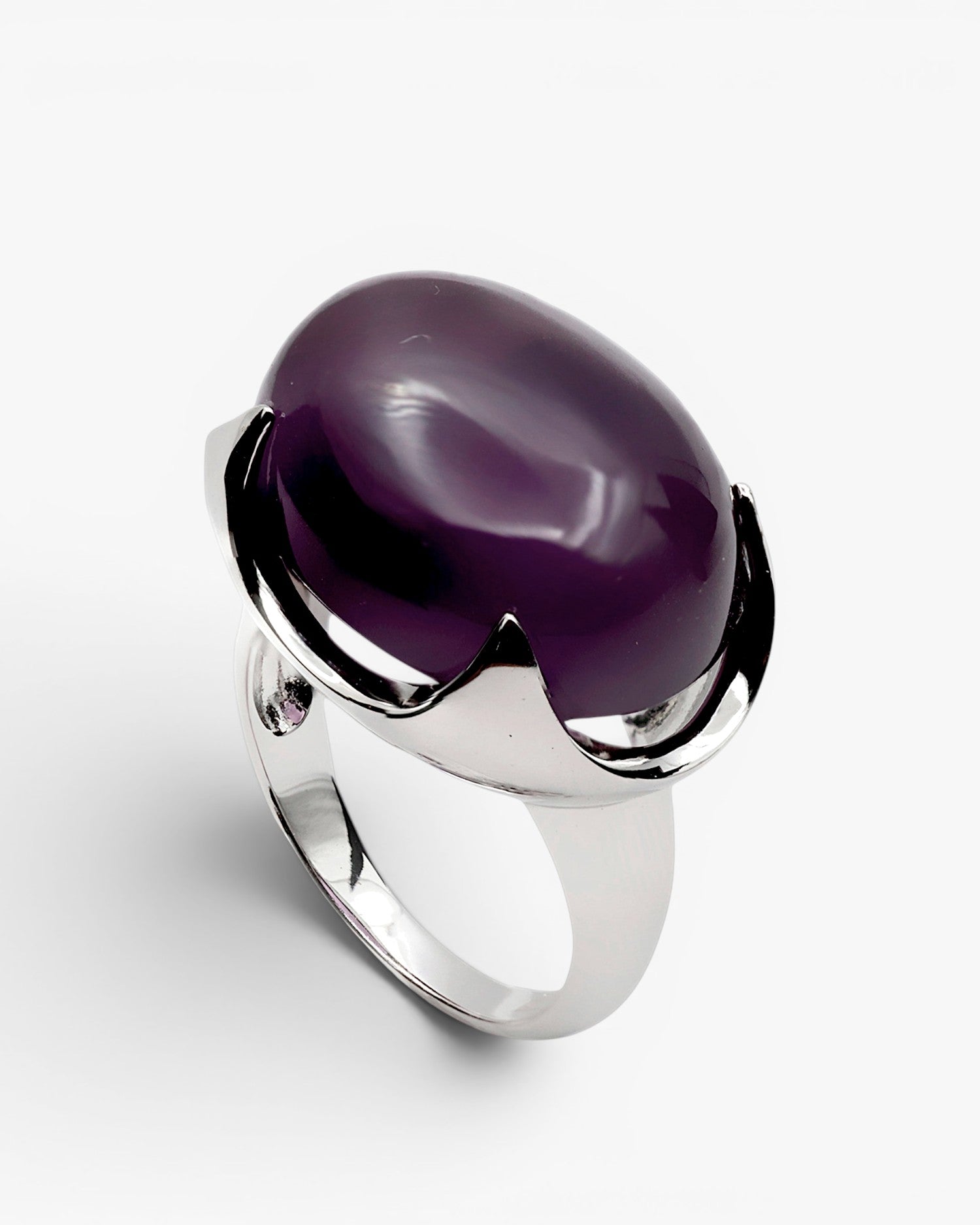 Rings with oval-shaped stones in a purple tone