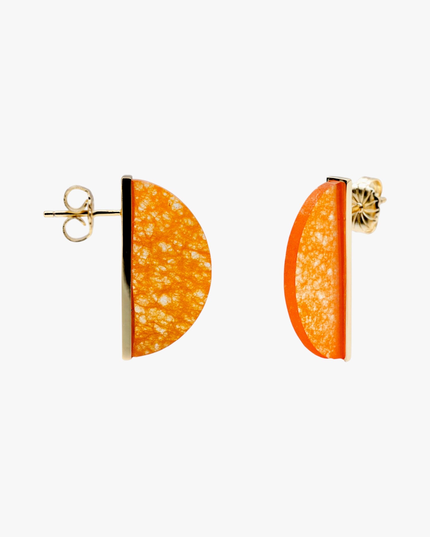 Earrings in orange-toned stone in the shape of a half circle