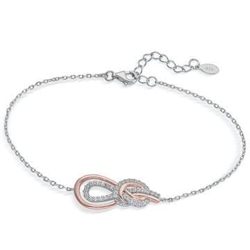Pulsera bicolor en rosa y circonitas blancas en diseño entrelazado