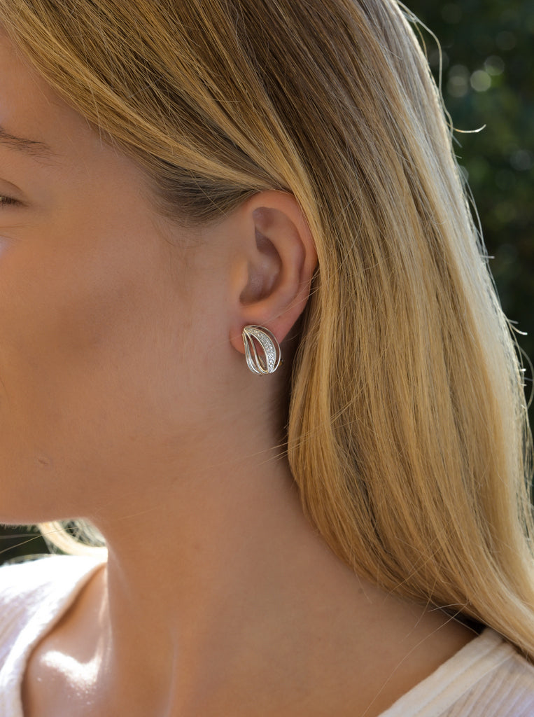 Intertwined design silver omega clasp earrings