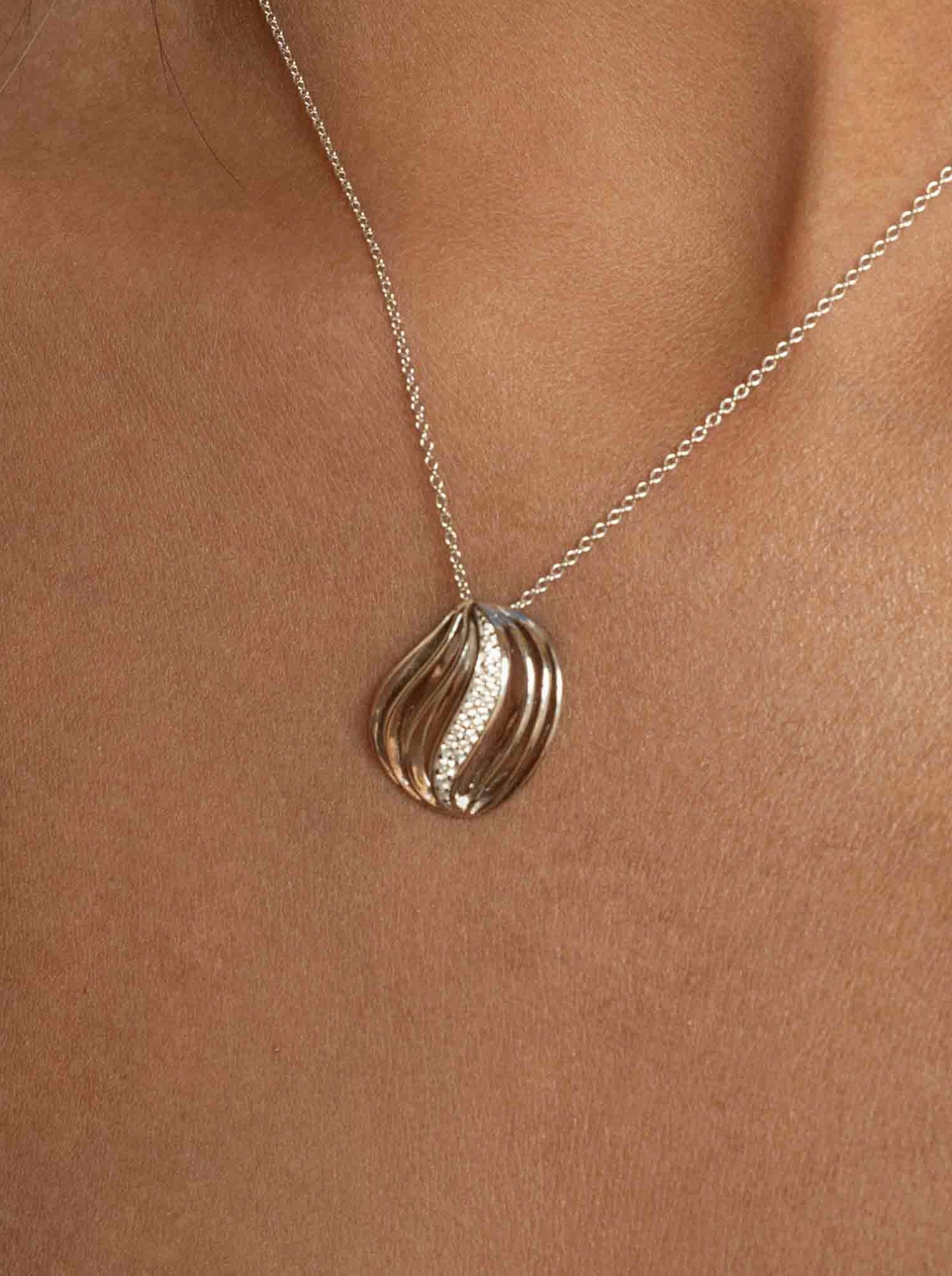 Silver necklace with waves and cubic zirconia
