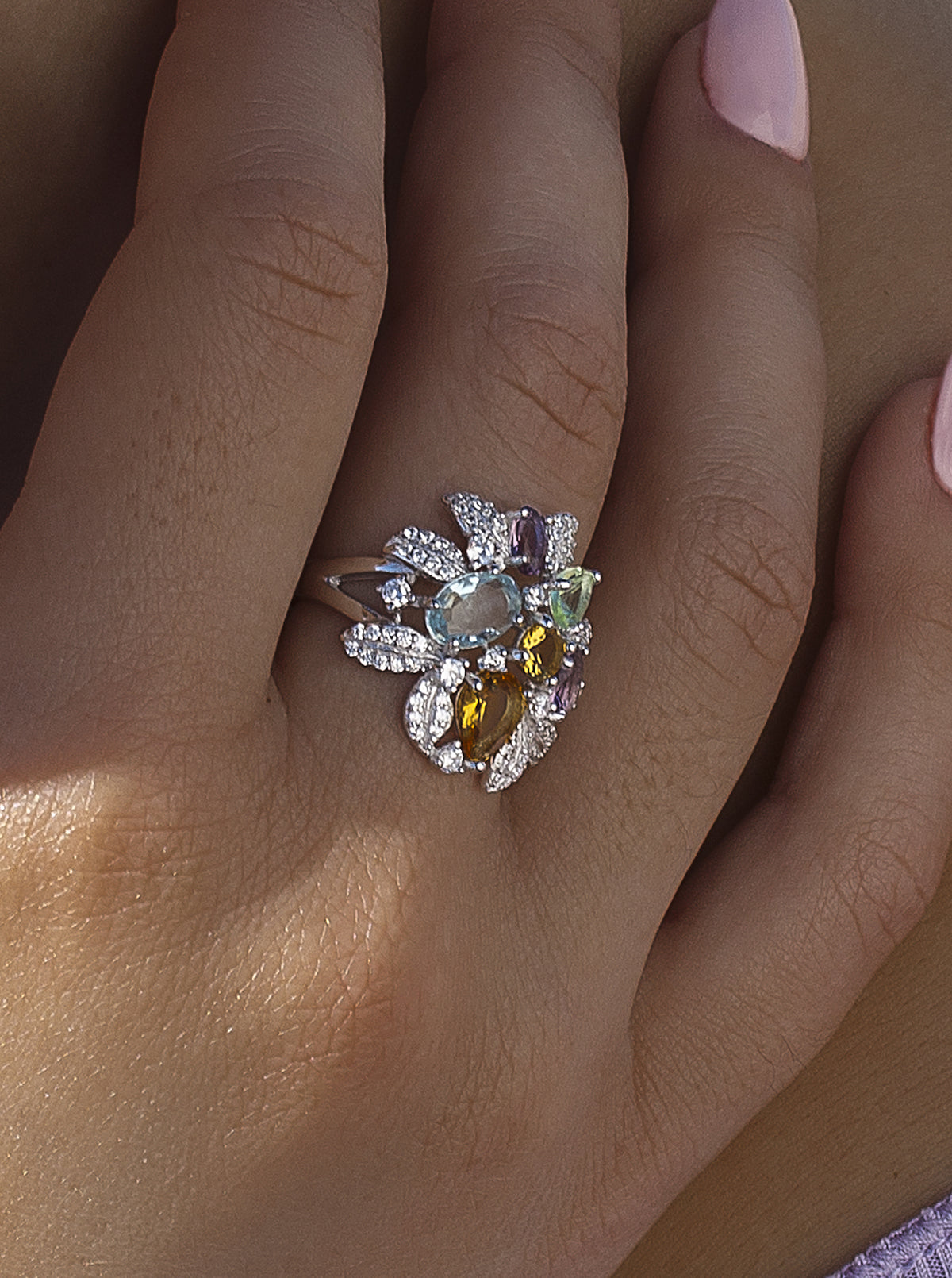 Baroque ring with stones in floral motifs
