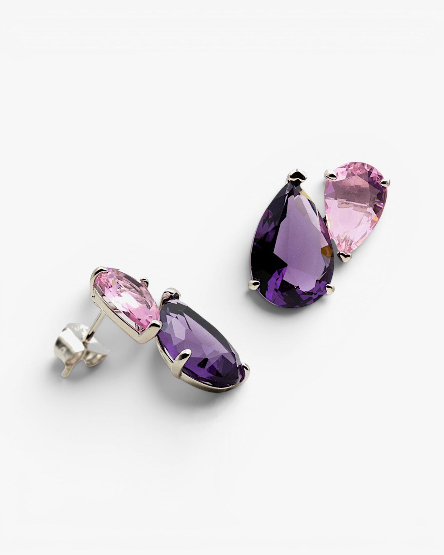 Pear-shaped earrings with pinkish-toned colored stones