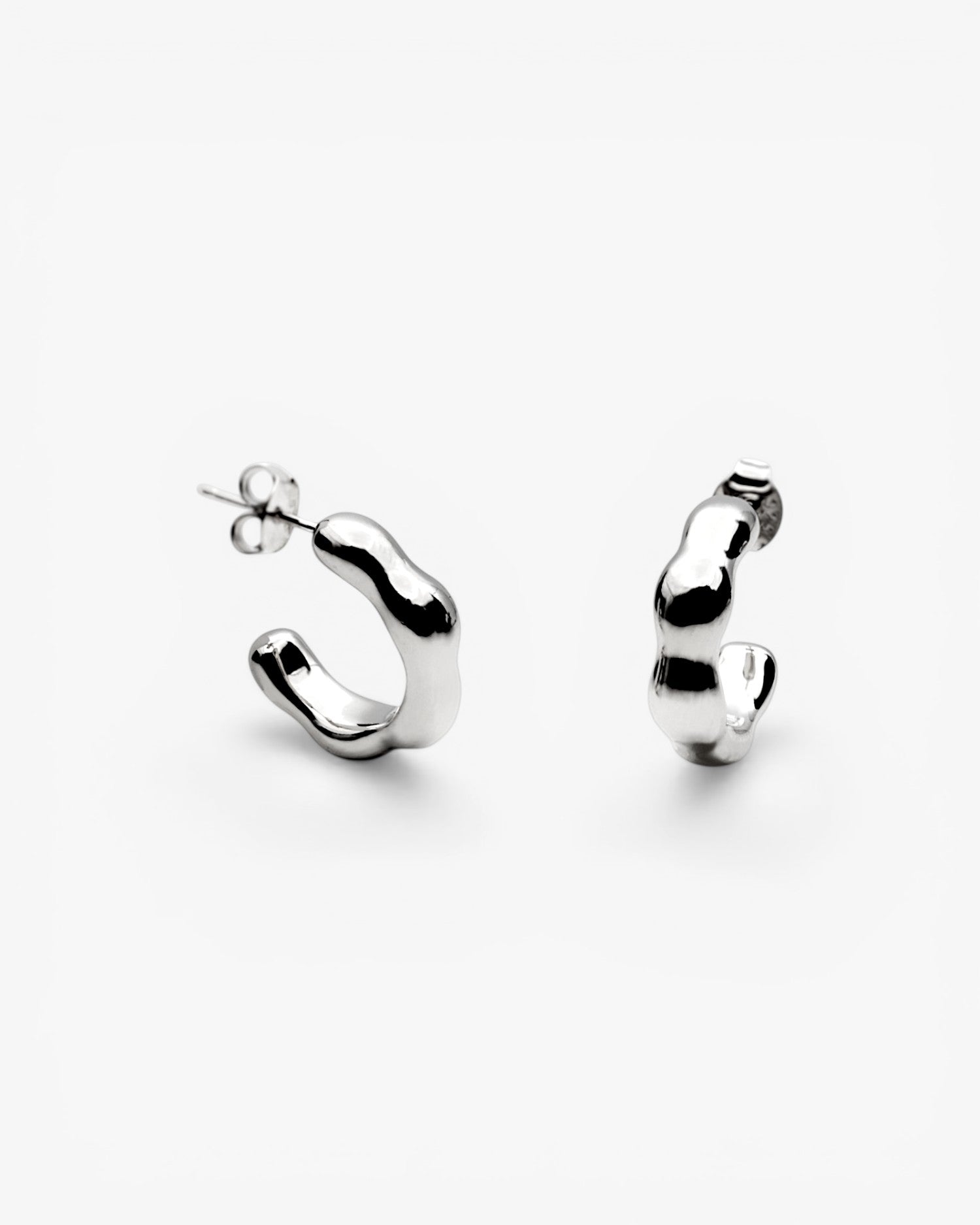Silver hoop earrings with irregular liquid design