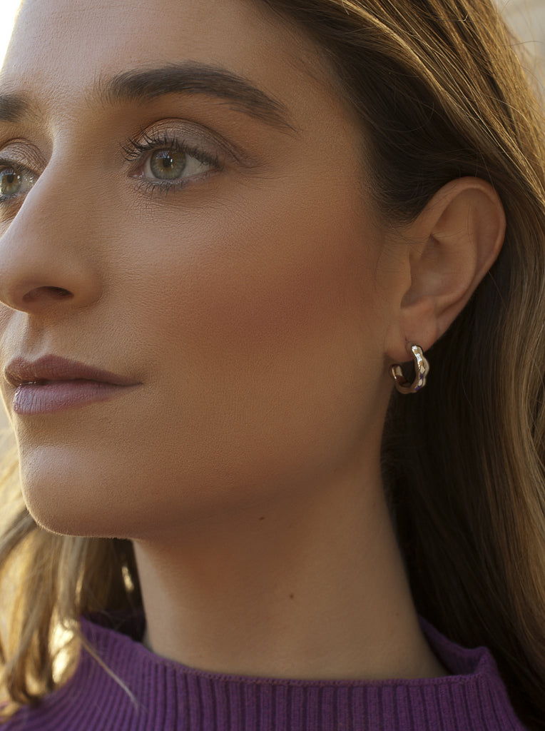 Silver hoop earrings with irregular liquid design