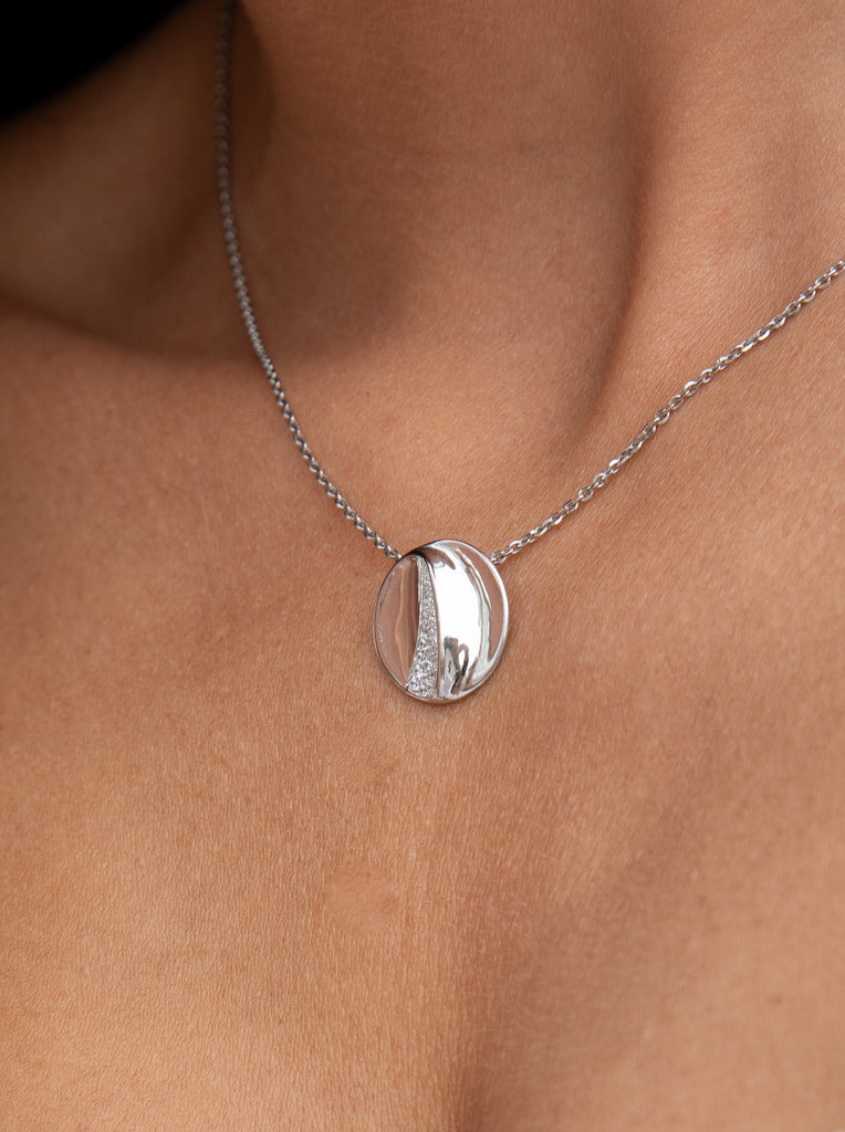 Small circular silver necklace with volume and cubic zirconia