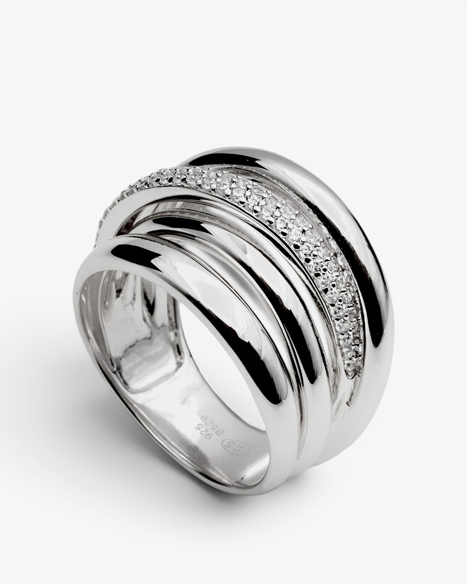 Anillo ancho de plata con rail de circonita superpuesta