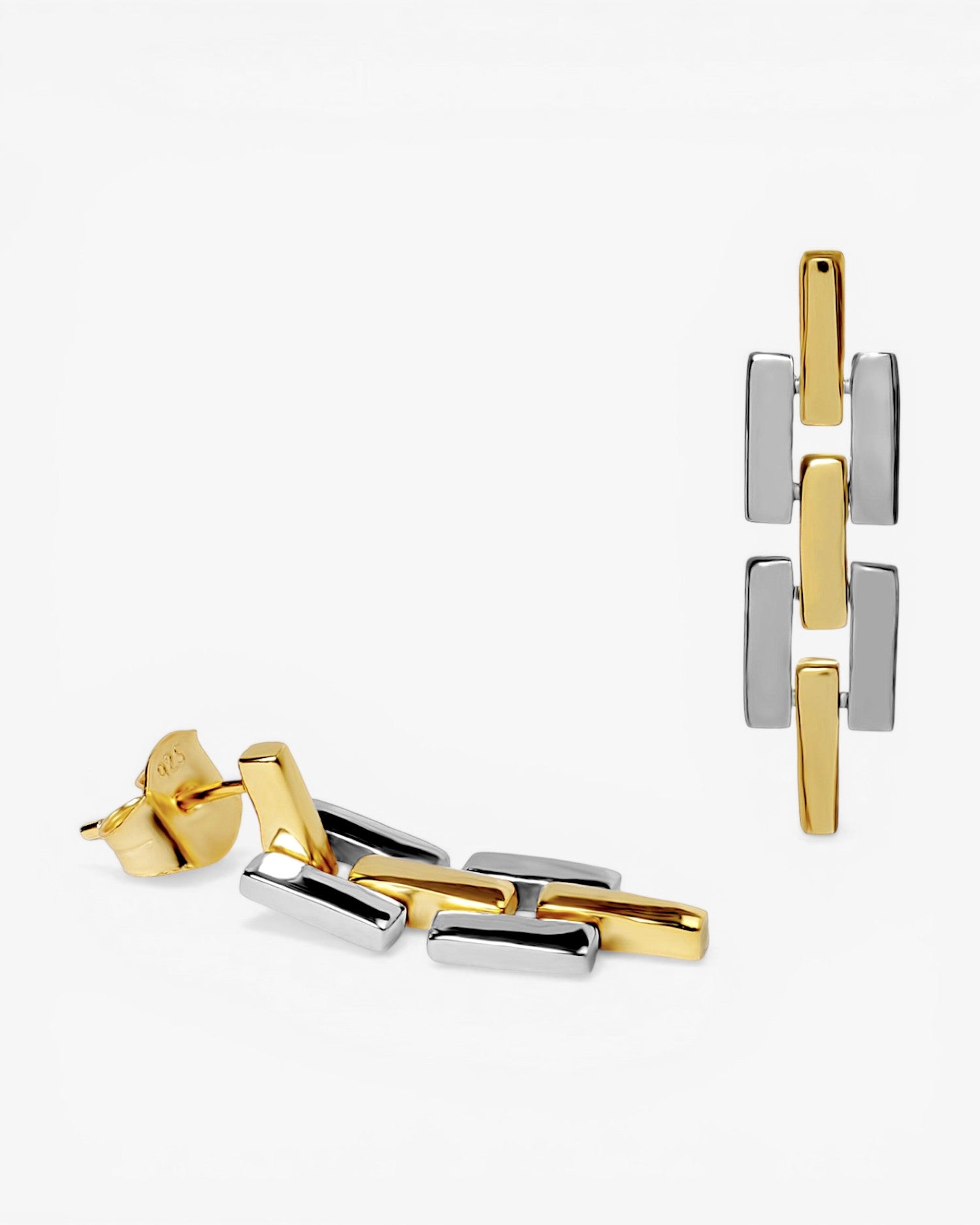 Pendientes bicolor de plata con circonitas y diseño tipo hebilla