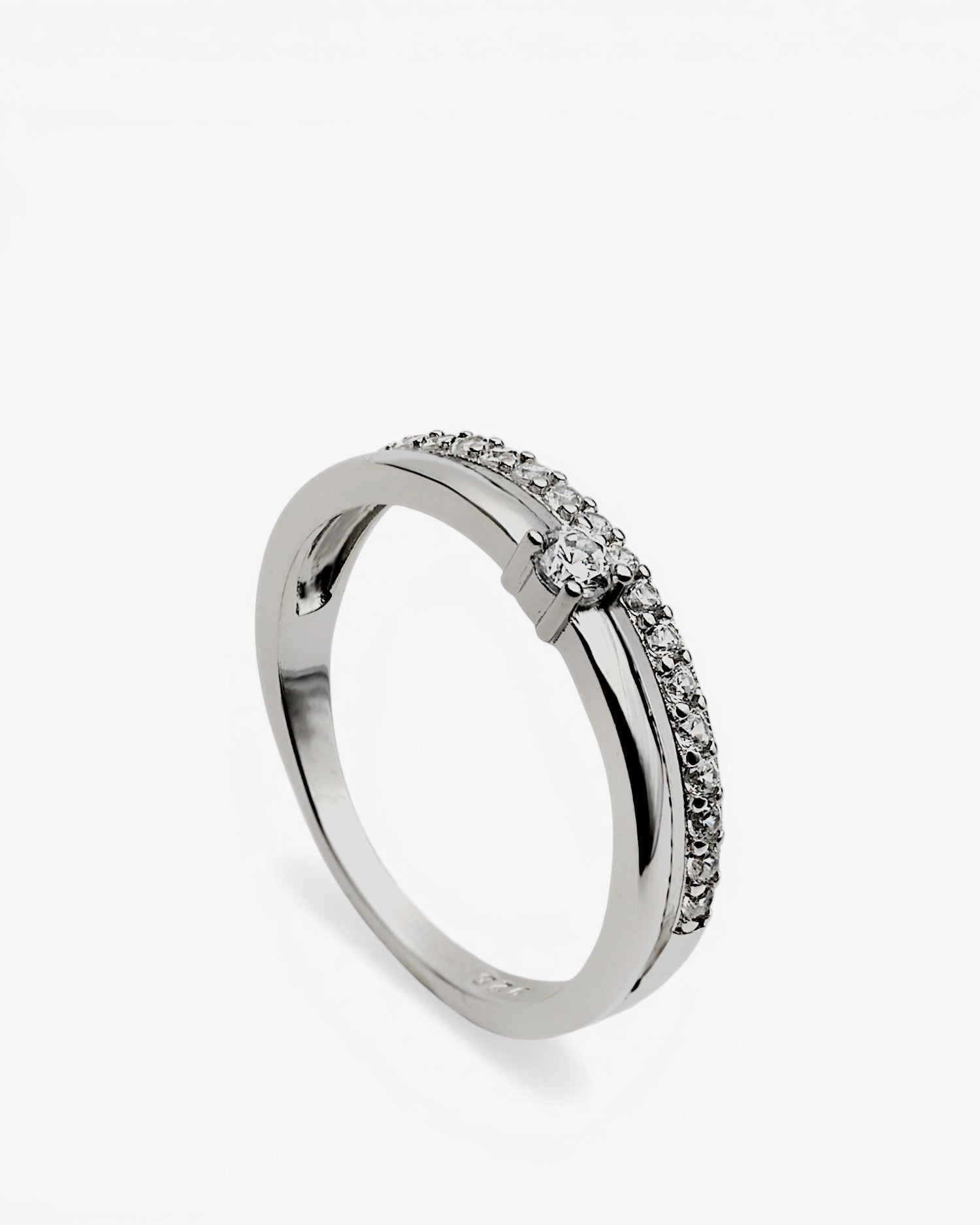 Delicate ring with double cubic zirconia and central cubic zirconia.