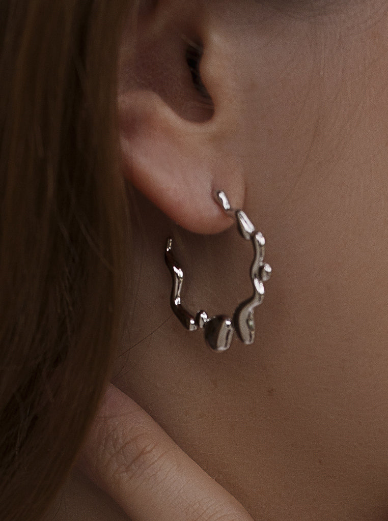 Boucles d'oreillesoriginaux créole avec design ondulé