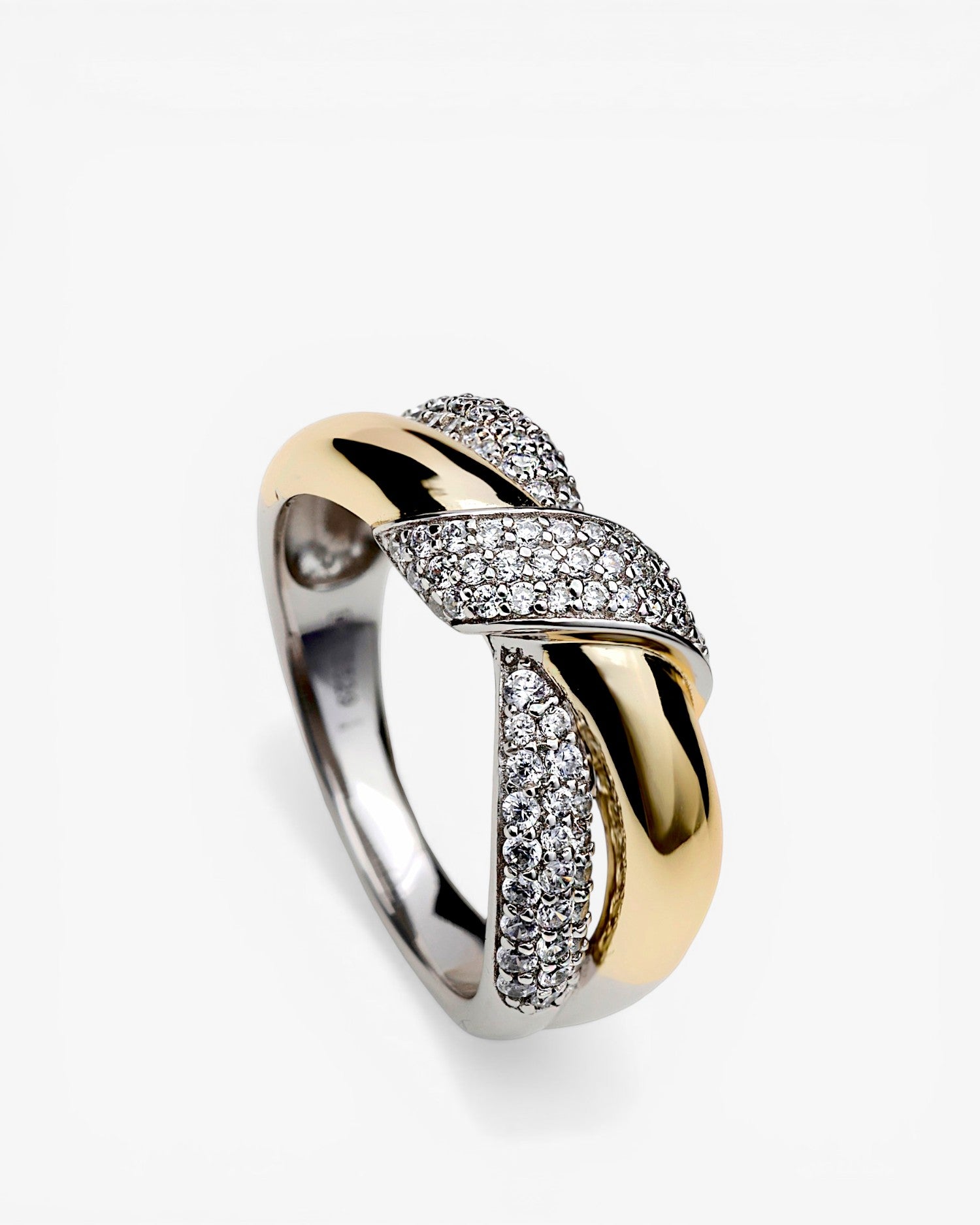 Two-tone ring linked with a knot and cubic zirconia