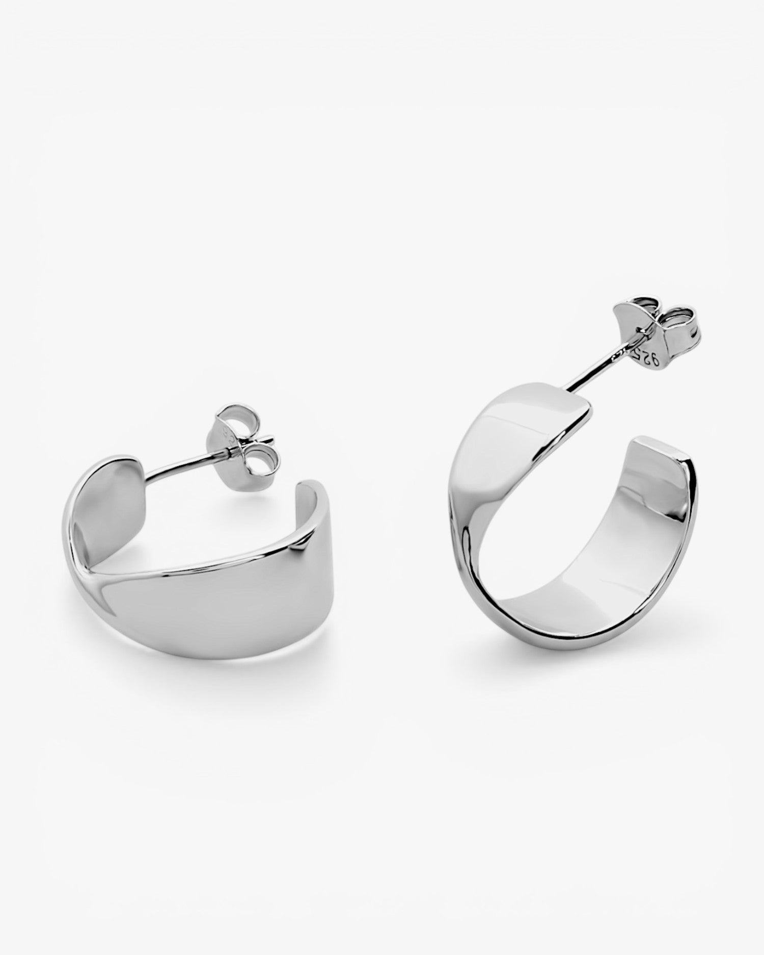 Silver earrings in a semi-open hoop
