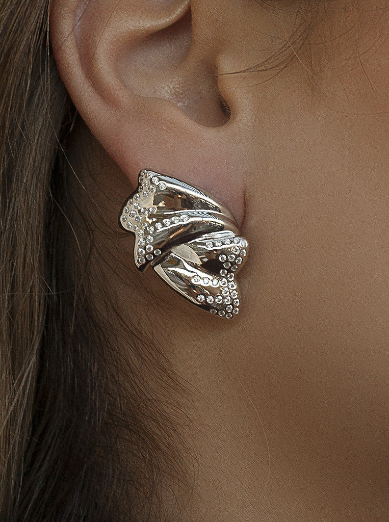 Sculptural silver earrings with cubic zirconia