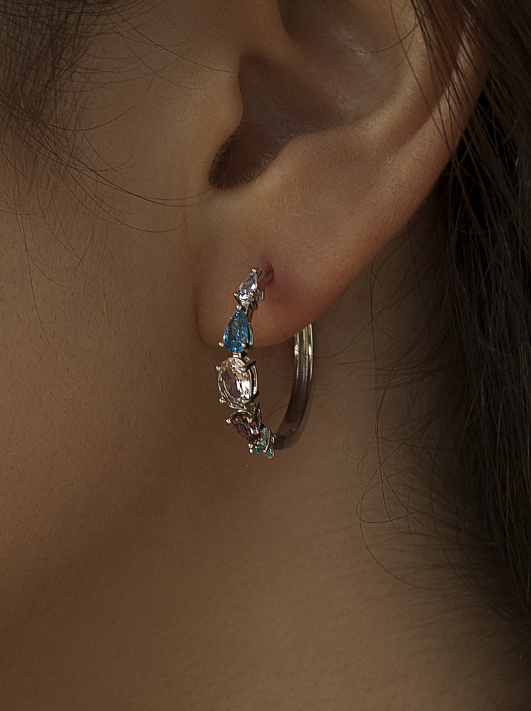 Silver hoop earrings with stones in shades of blue and pink