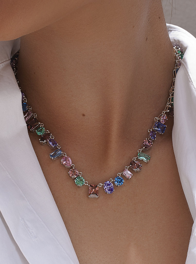 Necklaces with multicolored stones in a geometric design.