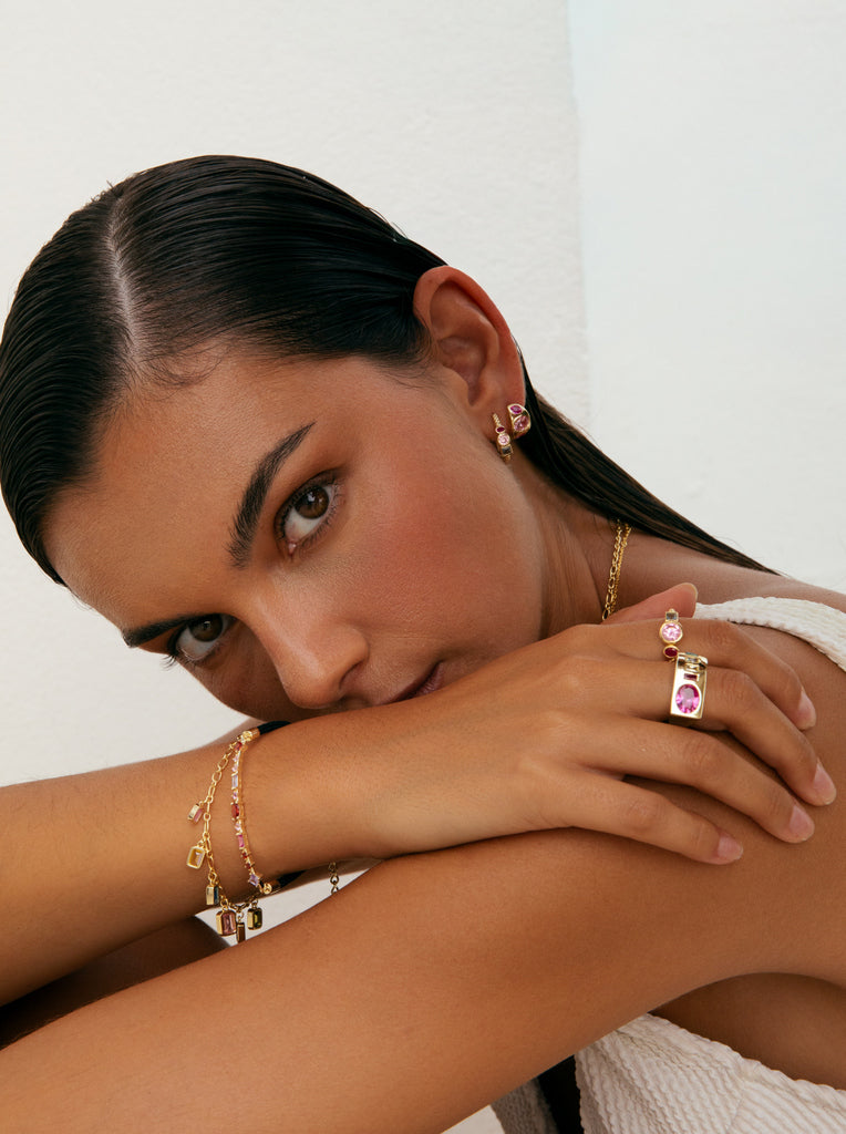 Pulsera de plata con piedras naranjas y cordón negro