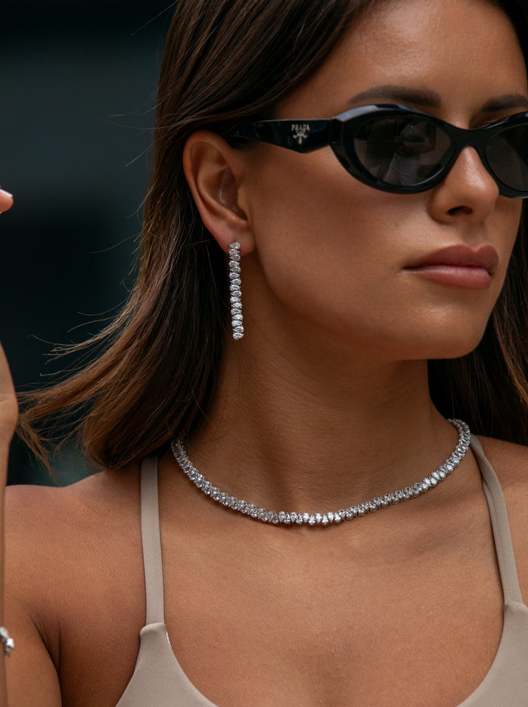 Pendientes largos de plata con circonitas talla pera